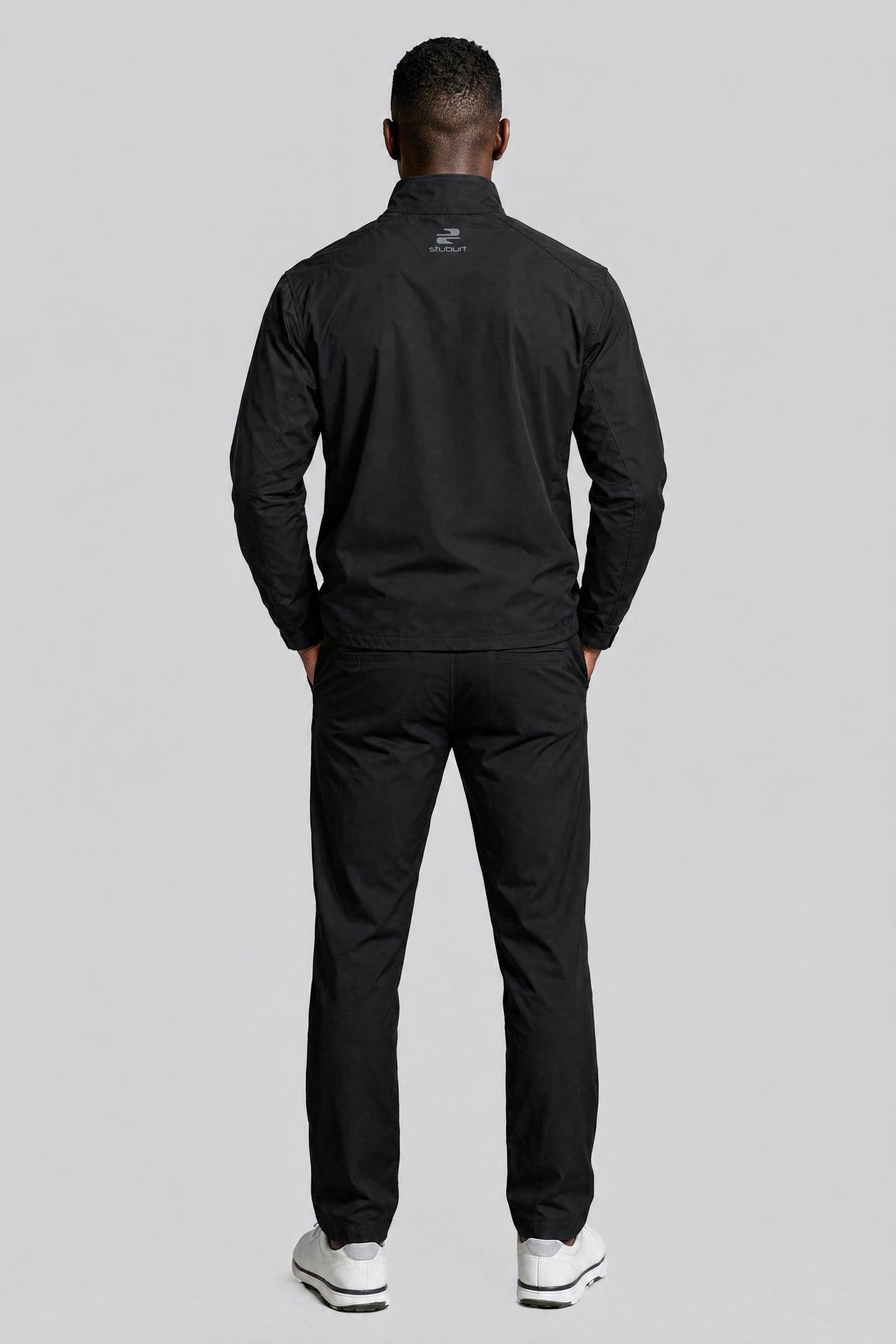 The waterproof golf suit in Black, back