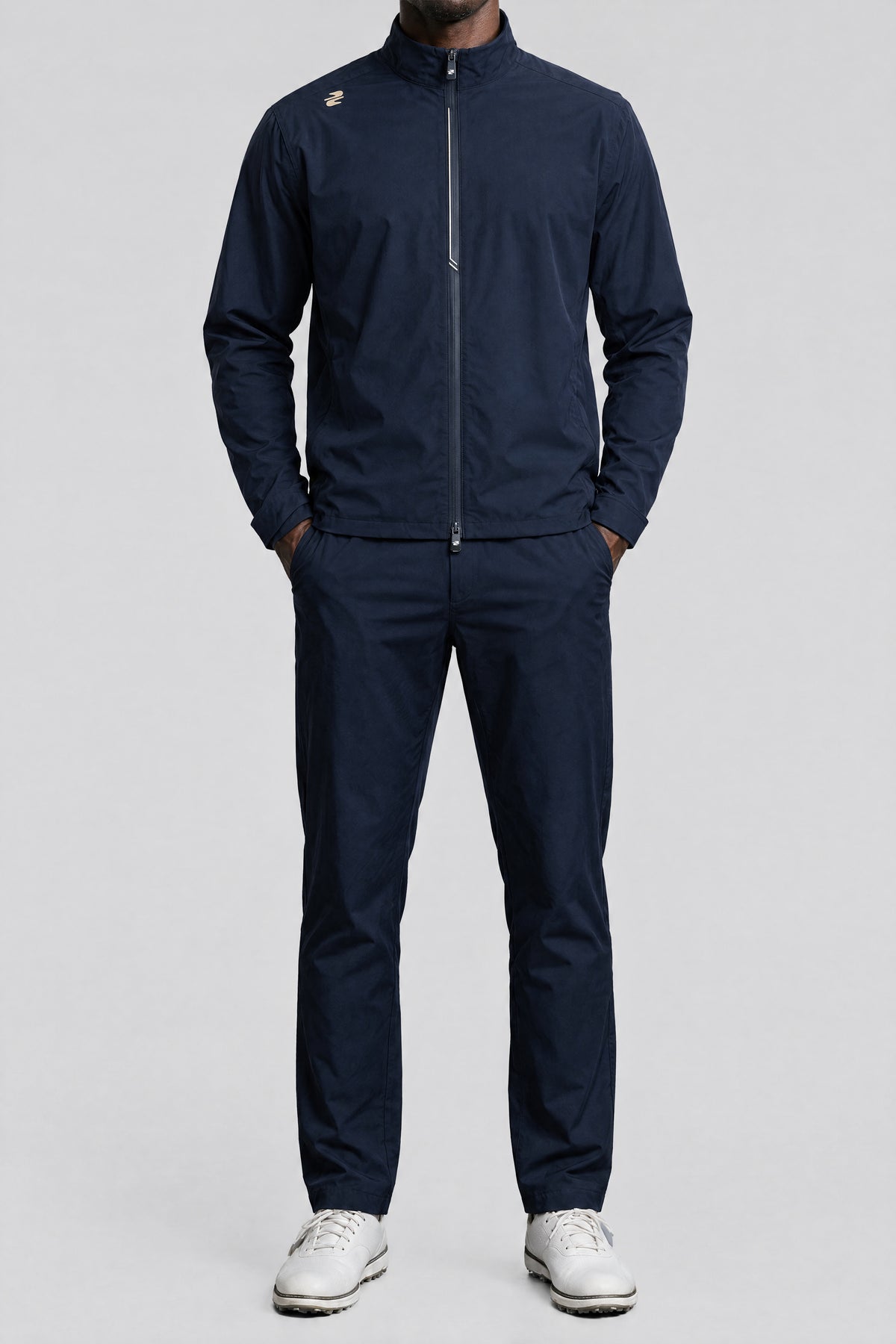 The waterproof golf suit in Navy, front