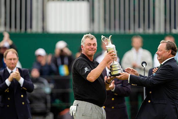 Royal St George's. Clarke lifts the Claret Jug.